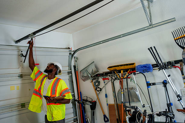 Professional Garage Door Panel Replacement technician working in Paterson, NJ